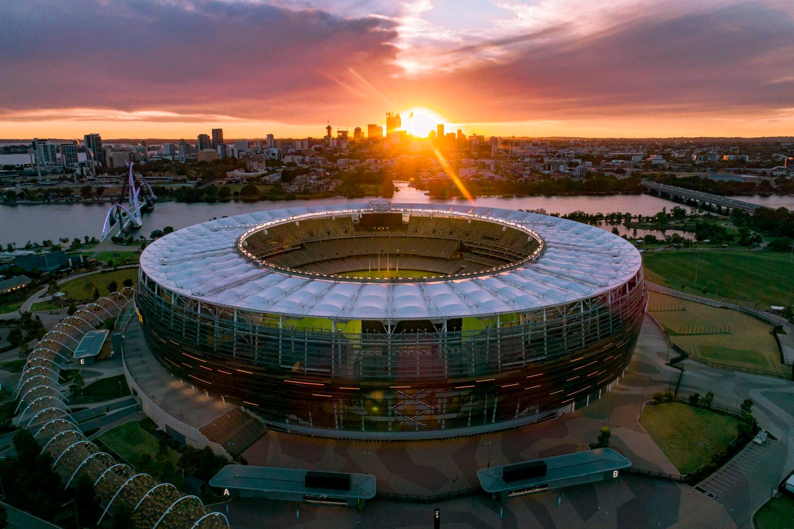 An Aerial View of a Soccer Stadium at Sunset